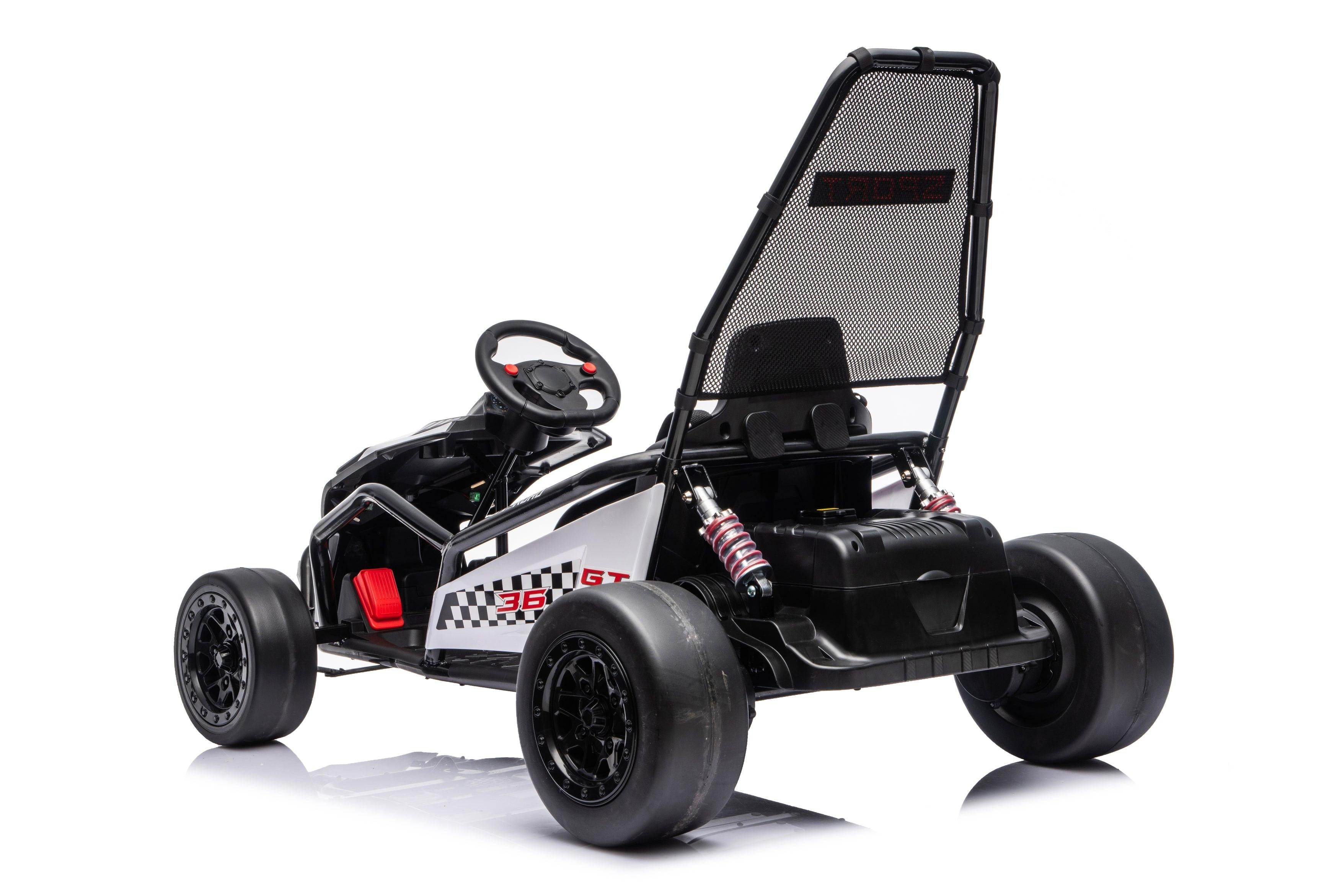 Black Outlaw Edition 24V ride-on go-kart for kids with child driving in modern showroom