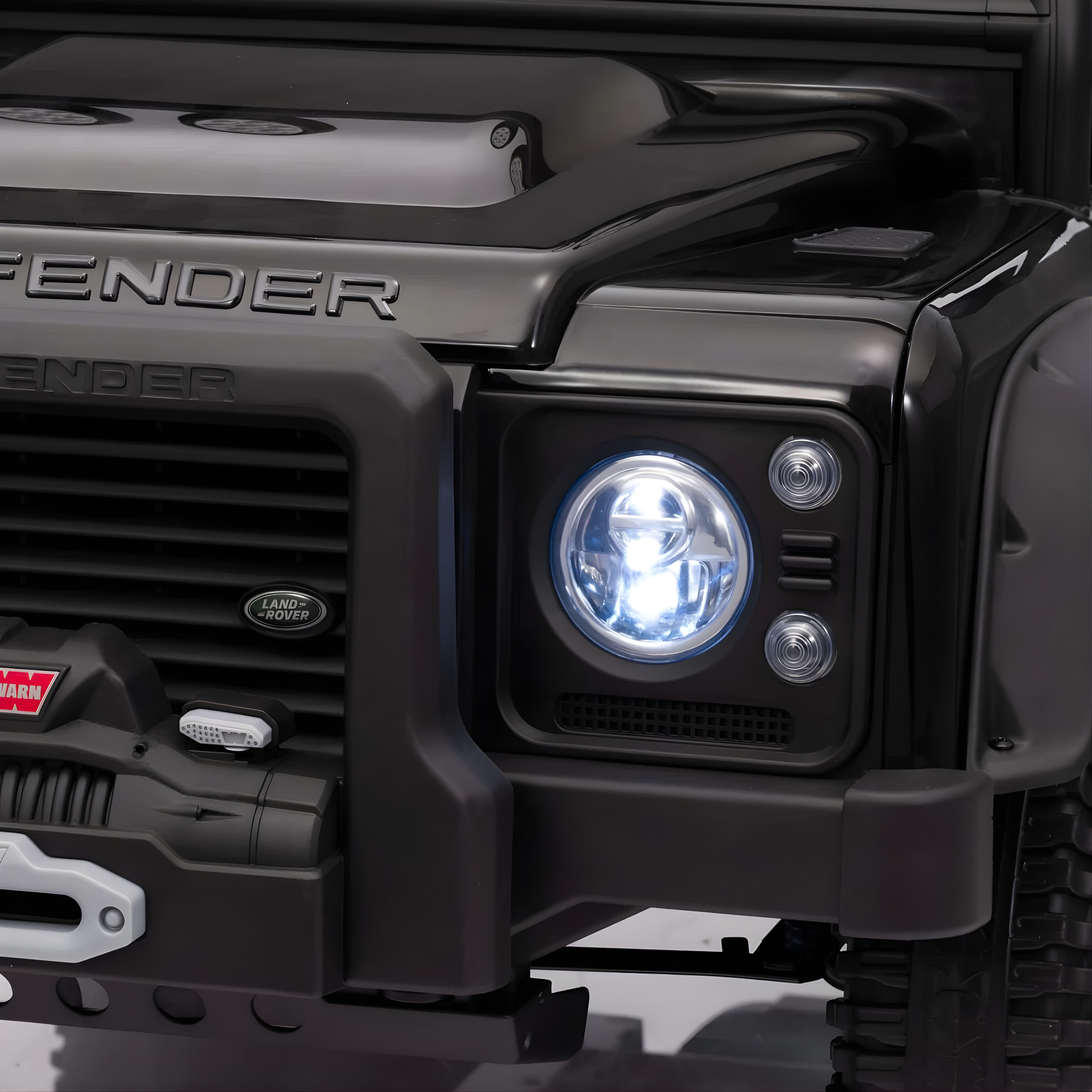 12V Black Land Rover Defender 1-Seater AWD Ride-on Truck W/ Rubber Wheels, Music Player & RC