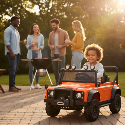 12V Orange Land Rover Defender 1-Seater AWD Ride-on Truck W/ Rubber Wheels, Music Player & RC