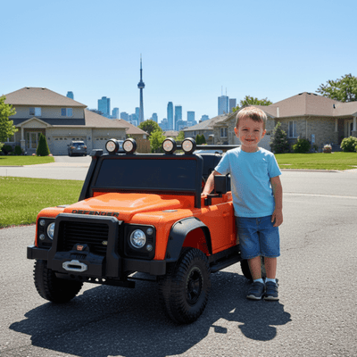 12V Orange Land Rover Defender 1-Seater AWD Ride-on Truck W/ Rubber Wheels, Music Player & RC.