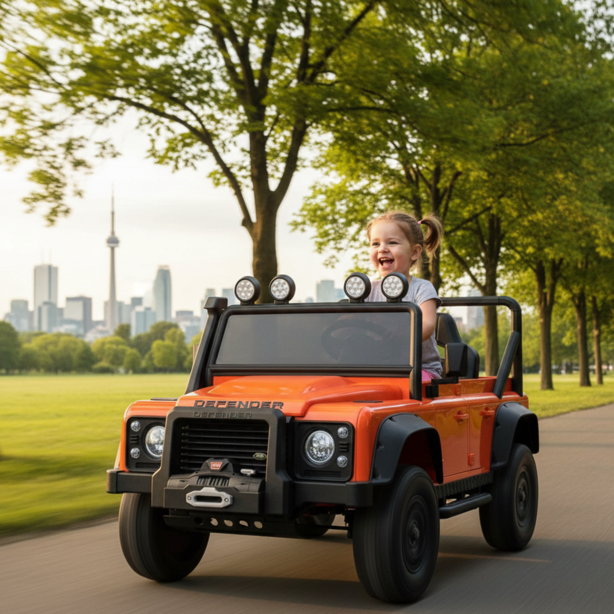 12V Orange Land Rover Defender 1-Seater AWD Ride-on Truck W/ Rubber Wheels, Music Player & RC
