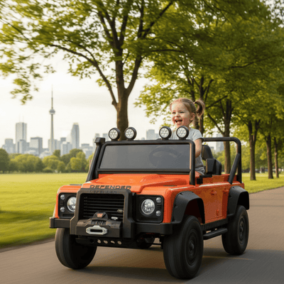 12V Orange Land Rover Defender 1-Seater AWD Ride-on Truck W/ Rubber Wheels, Music Player & RC.