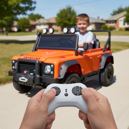 12V Orange Land Rover Defender 1-Seater AWD Ride-on Truck W/ Rubber Wheels, Music Player & RC