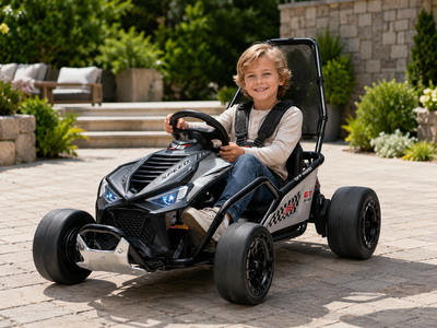 Black Outlaw Edition 24V ride-on go-kart with rear shock absorber and rear axle support