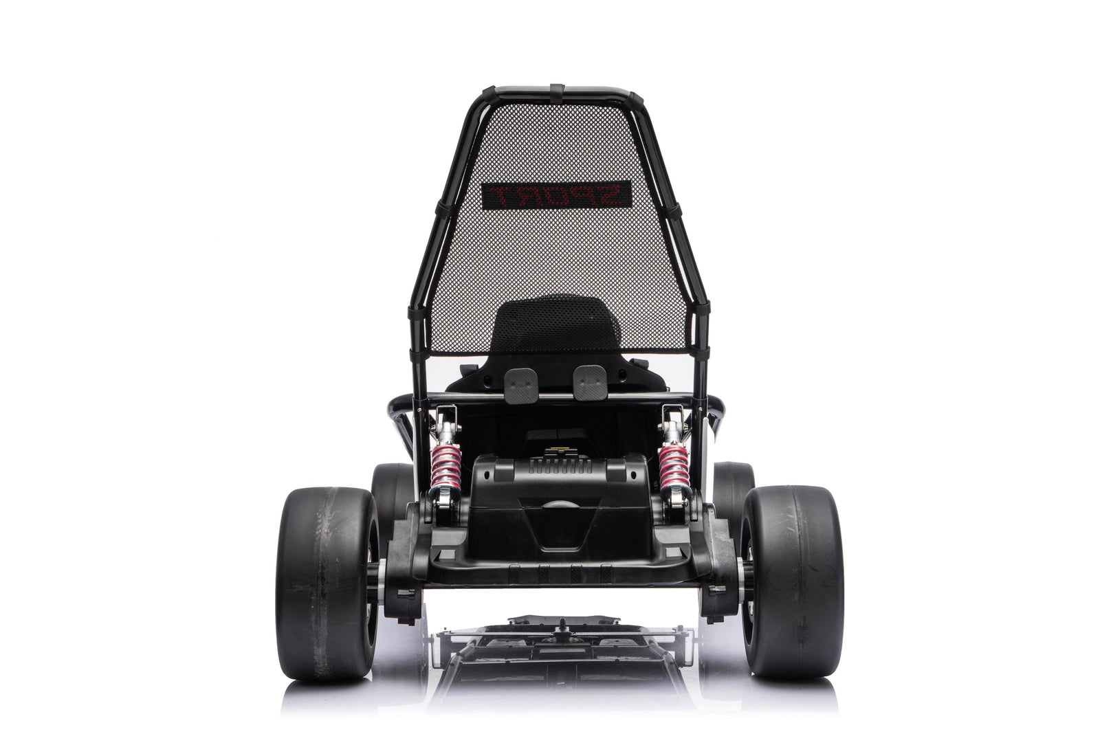 Black Outlaw Edition kids electric go-kart with child riding outdoors on driveway