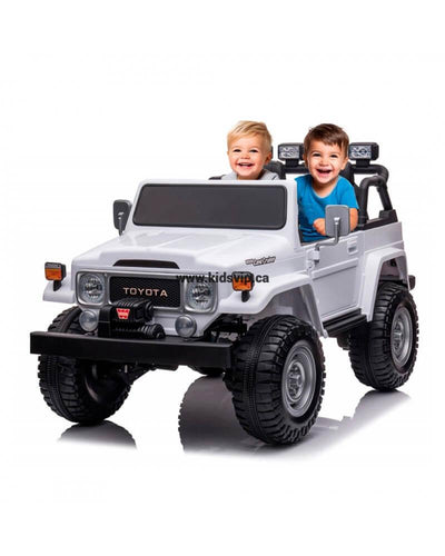 24V White 2-Seater Premium Edition Toyota 4x4 Truck for Kids W/ EVA Rubber Wheels, Music & RC.