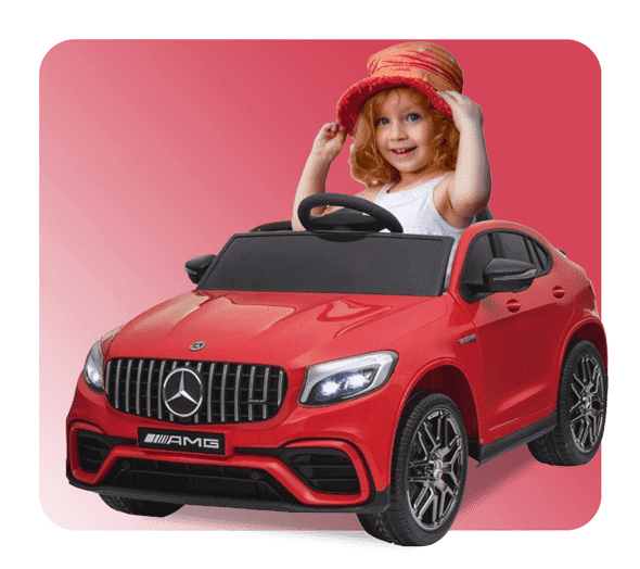 Cheerful Little Girl With A Red Sun Hat Playfully Posing In A Bright Red Mercedes Amg Ride-On Car For Kids, Highlighting The Fun And Stylish Options Available From Kidsvip'S Electric Cars For Kids Collection